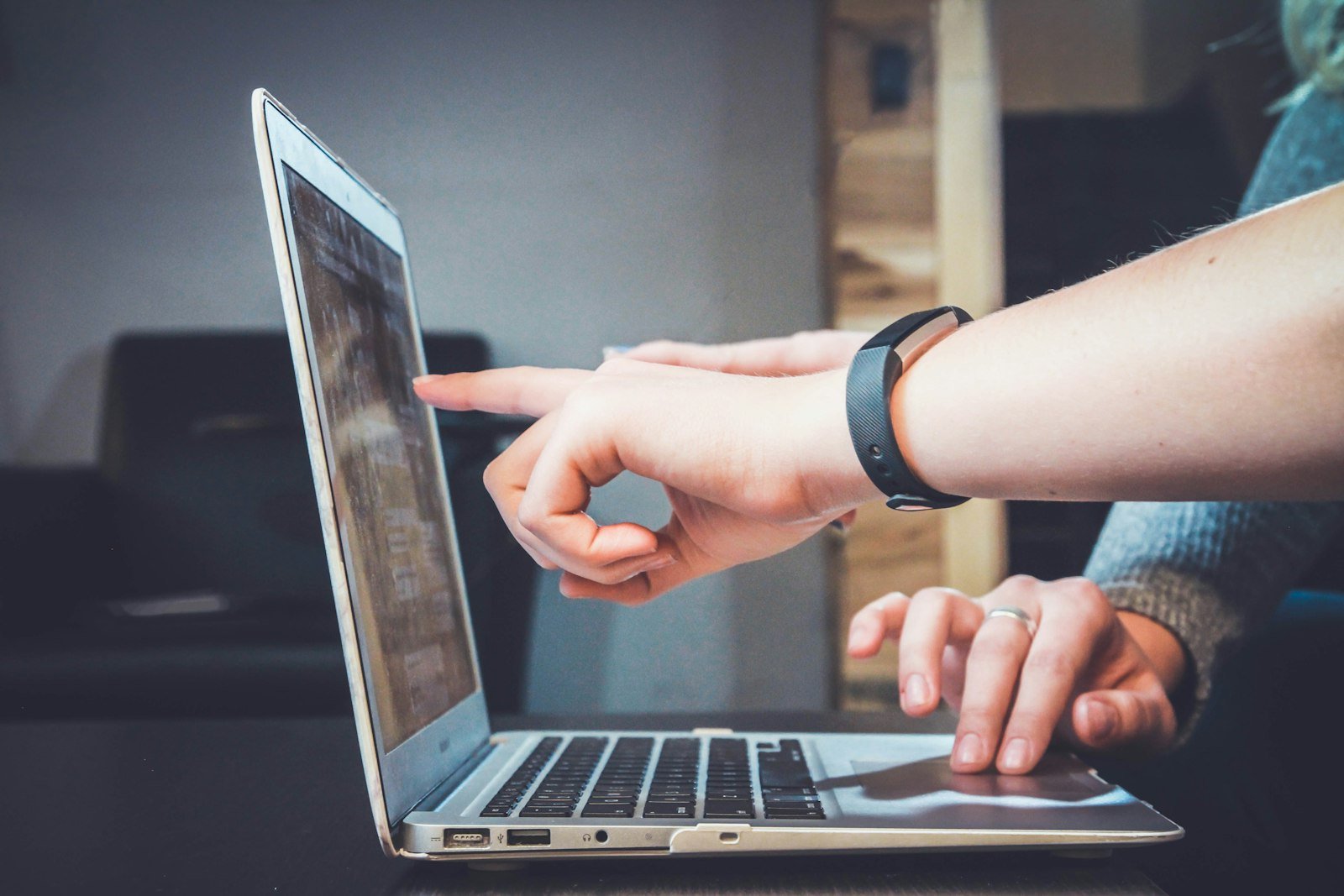 Hands paused at a keyboard before taking a governed action